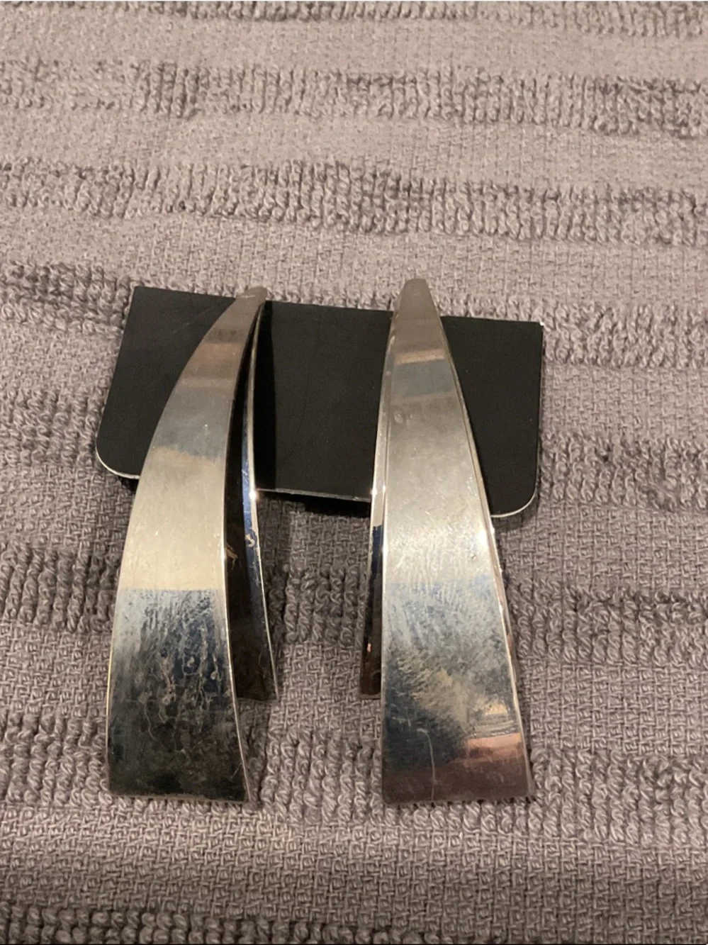 Silver tone earrings.